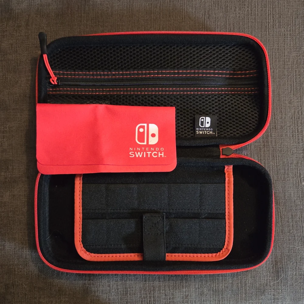 Official Nintendo Switch Red and Black Carrying Case With Microfiber Cloth.